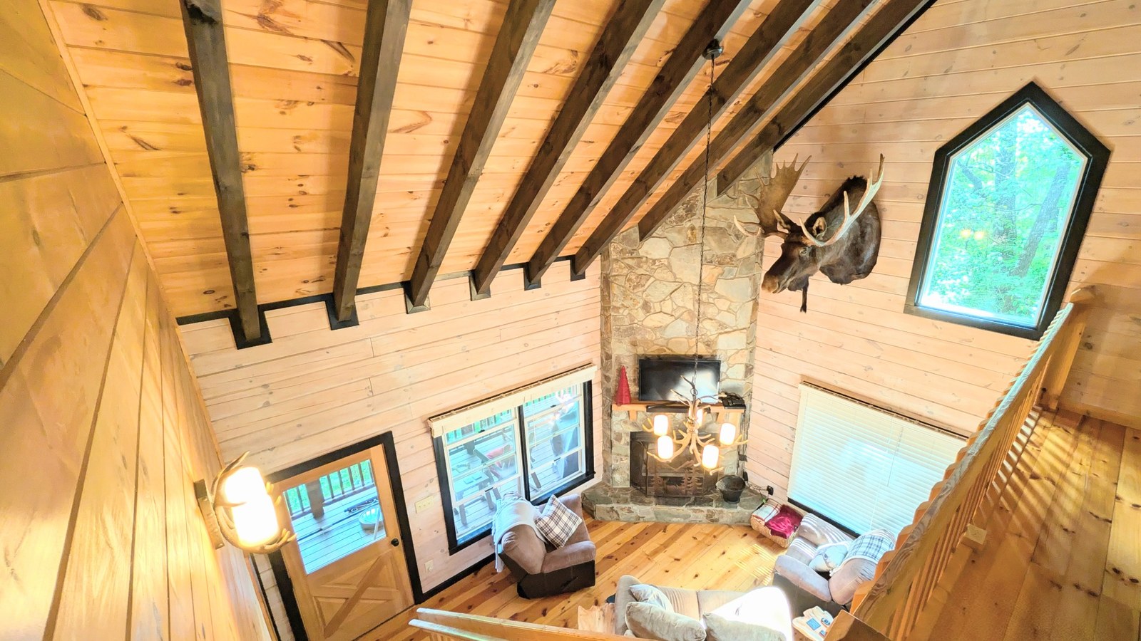 Looking down from the loft into the main living area.